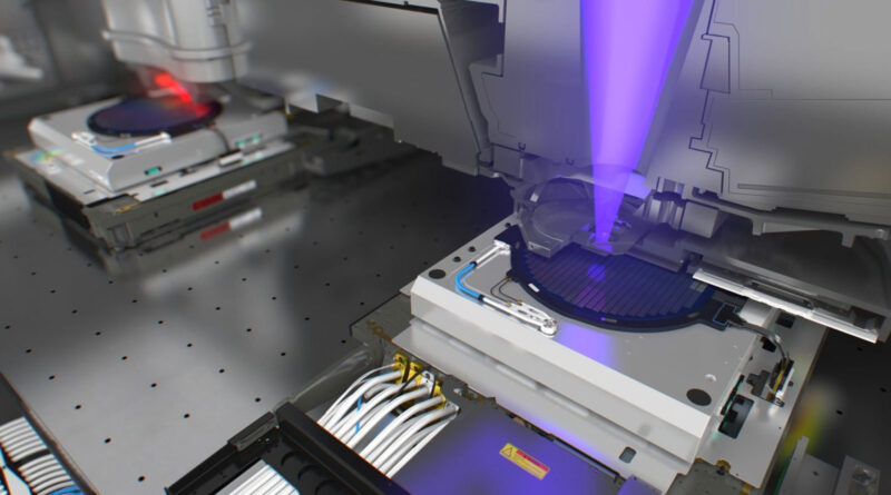 Componentes de tecnología avanzada en un entorno de laboratorio, con luces azul y roja, mostrando equipos de precisión utilizados en fabricación.