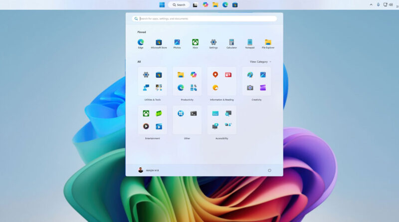 Interfaz de Windows 11 mostrando el menú de aplicaciones con iconos en un fondo de color suave, predominan los tonos azules y verdes.
