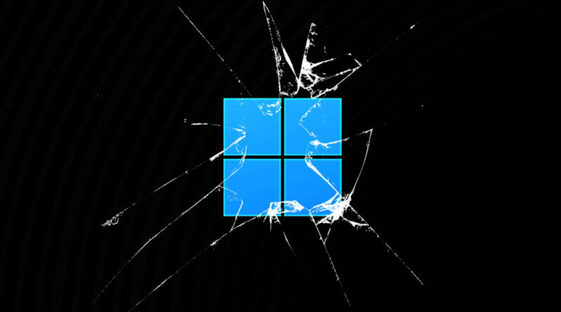 Logotipo de Windows 11 en azul, con un efecto de grietas en un fondo negro, simbolizando un fallo o daño en el sistema.