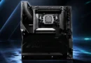 Placa madre AORUS con socket AM5, diseño negro y detalles en relieve, enfocada en el overclocking, iluminada en un fondo azul.