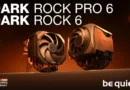 Disipadores Dark Rock 6 y Pro 6 con diseño en tonos oscuros y detalles en metal, sobre fondo luminoso anaranjado.
