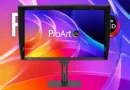 Monitor ProArt OLED con colores vibrantes y diseño elegante, presentado frente a un fondo abstracto en tonos púrpura y naranja.