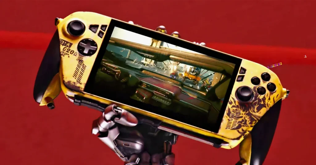 Controlador de videojuegos personalizado en tonos amarillos y negros, mostrando un juego de conducción en su pantalla, sostenido por un brazo robótico.