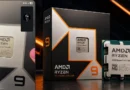 Caja de procesador AMD Ryzen 9 con fondo negro, destacando el logo naranja y plateado. Procesador visible al lado derecho.