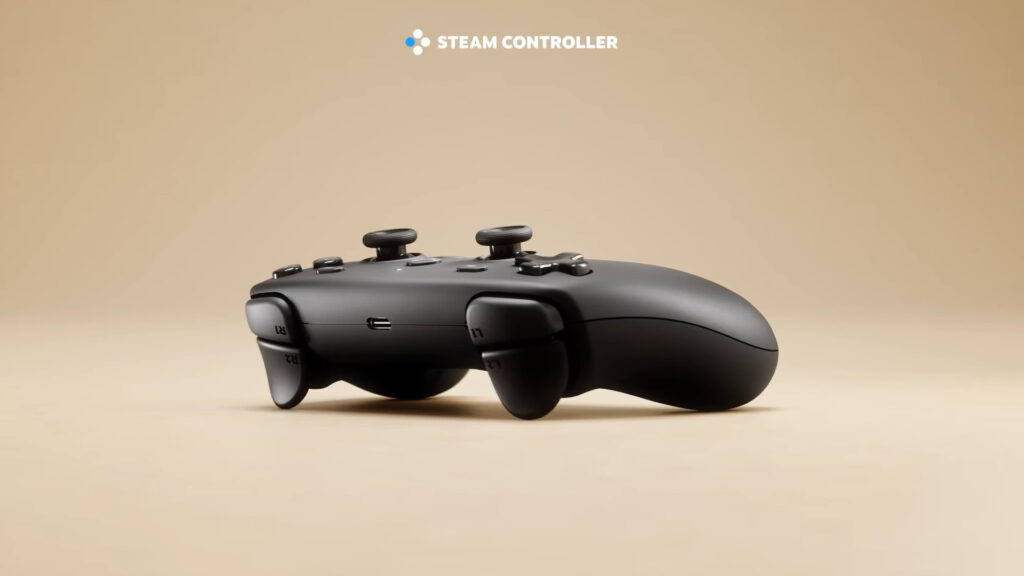 Controlador Steam en color negro, perfilado sobre un fondo beige, con botones analógicos y diseño ergonómico distintivo.