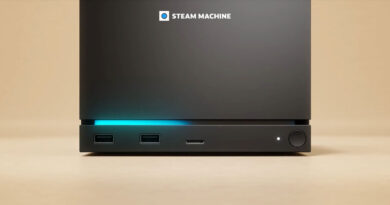 Consola de videojuegos Steam Machine en tonos oscuros, con puertos USB y una luz azul iluminando la parte frontal.