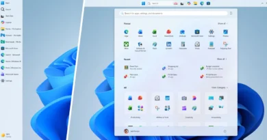 Barra de tareas de Windows 11 mostrando iconos de aplicaciones, un fondo azul claro y un menú de búsqueda en la parte superior.