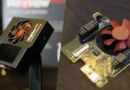 Muestra el WireView Pro II, un dispositivo con ventilador rojo, y su placa de circuito con conectores, sobre fondo oscuro.