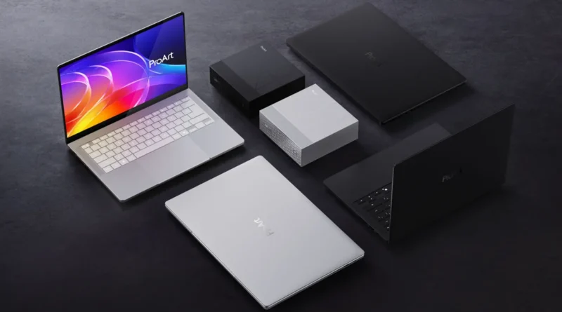 Varias laptops y dispositivos ProArt en colores gris y negro, dispuestos sobre una superficie oscura, destacando su diseño moderno.