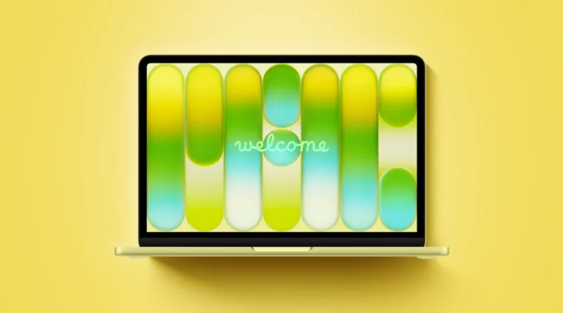 Portátil con pantalla amarilla mostrando un diseño gráfico en tonos verdes y amarillos, con la palabra "welcome" en el centro.