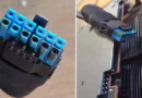 Conector de alimentación de la GPU Sapphire RX 9070 XT con daños visibles, relacionado con fallas térmicas reportadas.